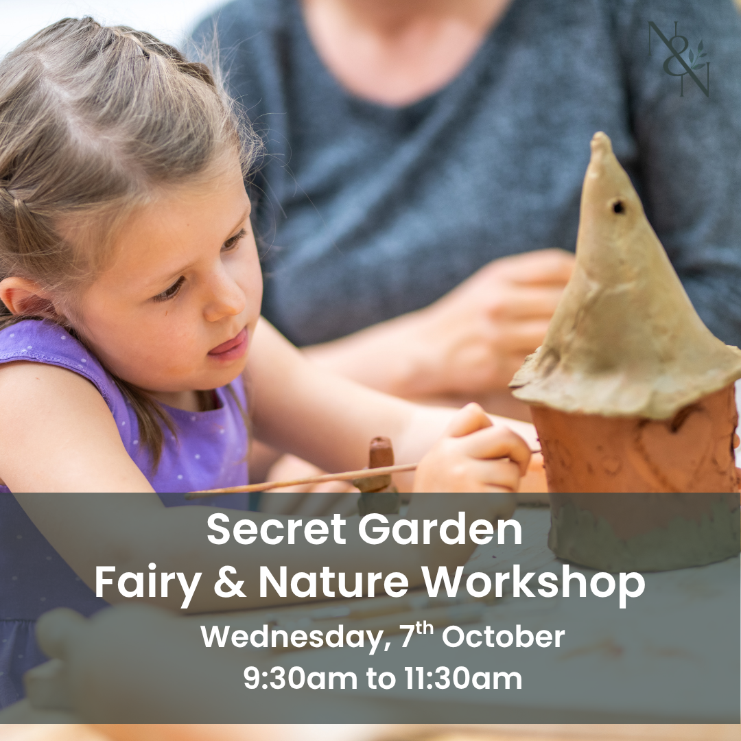 Child painting a clay castle or fairy garden structure, close view of hands with the project; Nature & Nurture watermark in the top-right.
